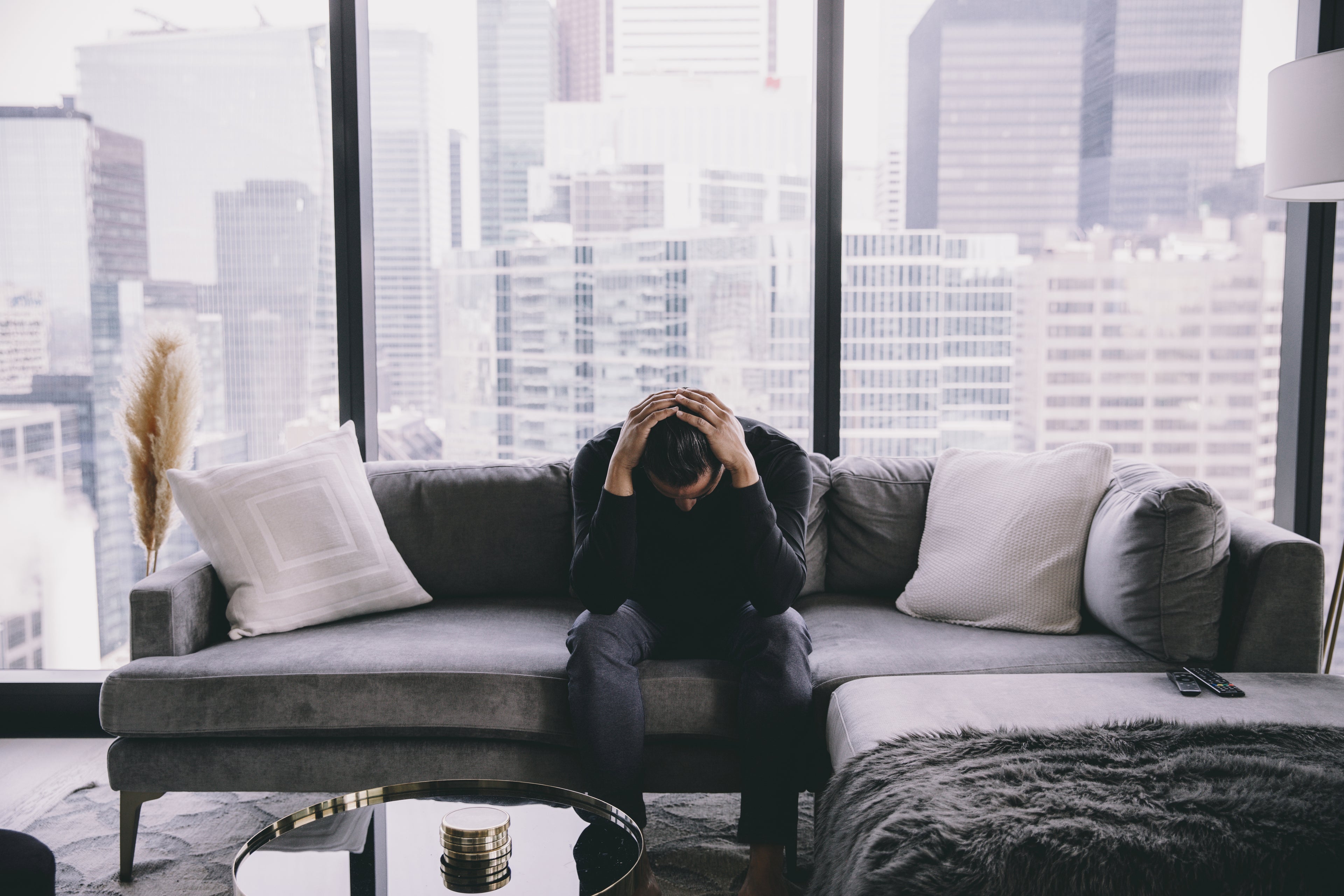 eap training, man sitting on couch with hands on head